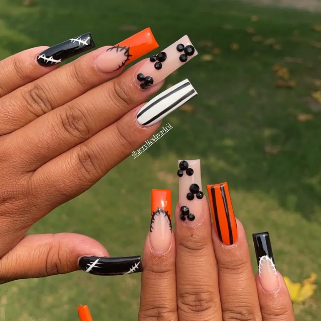 Stripes and Stitching halloween nails