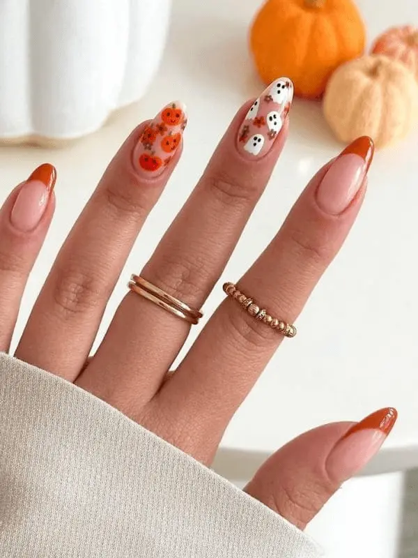 ghost and pumpkin nail design