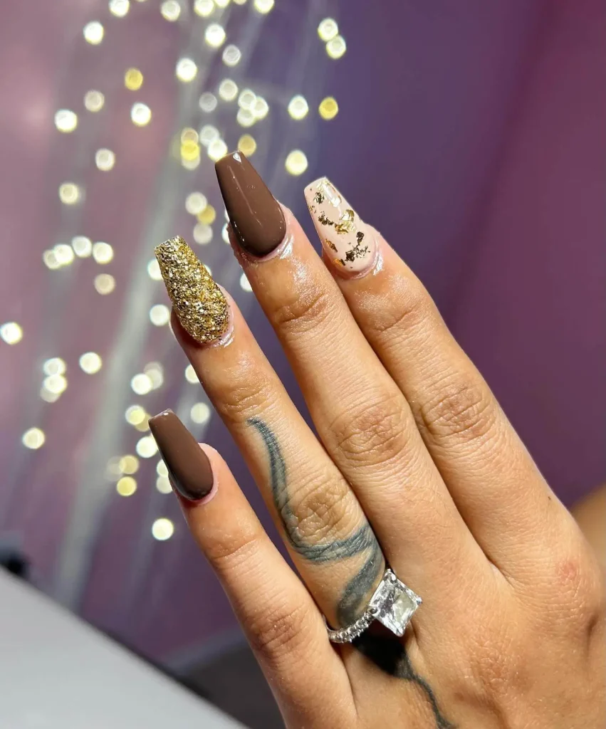 Brown glitter nail design